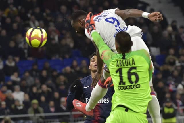 Moussa Dembele heads Lyon level in their 2-1 victory over PSG. Picture: AFP/Getty