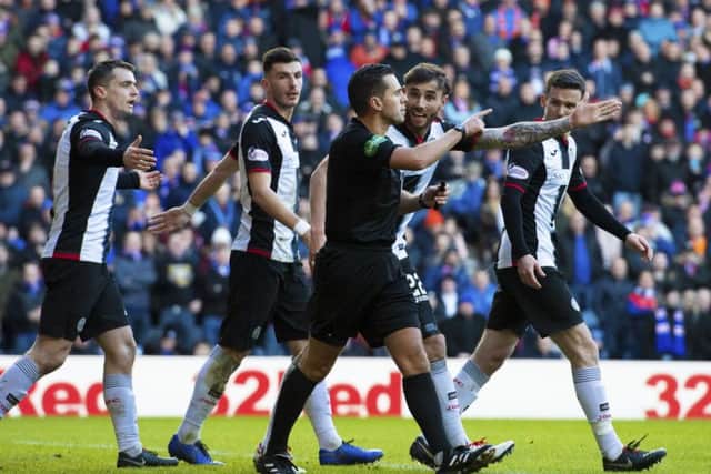 The St Mirren players appeal to referee Andrew Dallas after Rangers' are awarded their second penalty this afternoon. Picture: SNS/Alan Harvey