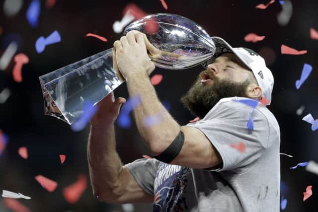 Julian Edelman, who was voted MVP,  lifts the trophy after New England Patriots won Super Bowl. Picture: AP.
