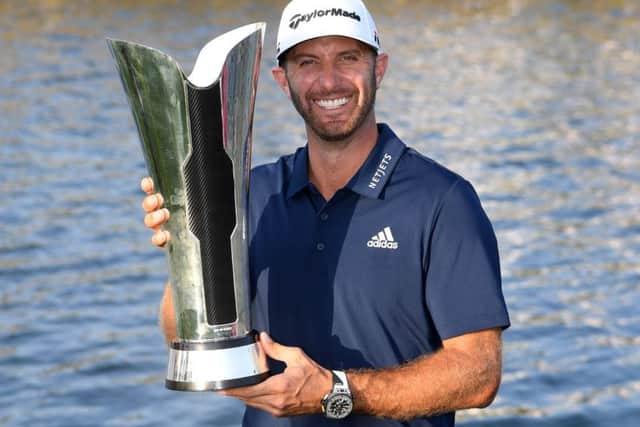 Dustin Johnson celebrates with the trophy after winning the Saudi International. Picture: Getty.