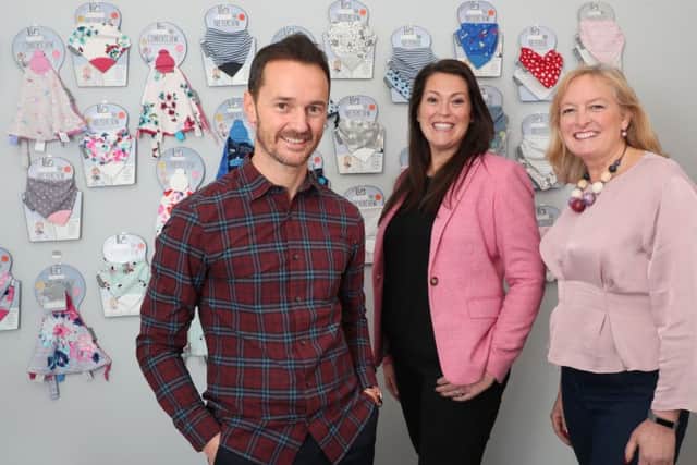 From left: Mike Welch, Amy Livingstone and Julie Wilson with Cheeky Chompers products. Picture: Stewart Attwood.