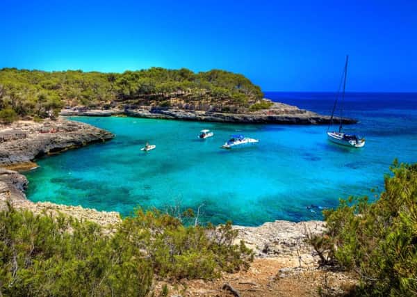 The secluded bays and quiet fishing villages are a world away from the party hotspots of Majorca