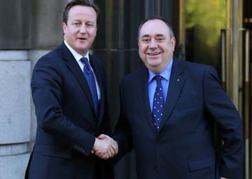 Former Prime Minister David Cameron shakes hands with Scotland's former First Minister Alex Salmond. Picture: Andrew Milligan/PA Wire