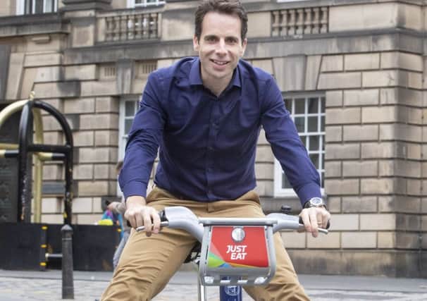 Cyclist Mark Beaumont helps launch Just Eat Cycles in September last year (Picture: SWNS)
