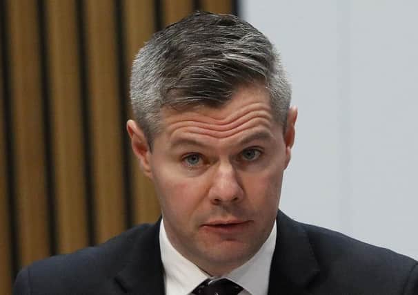 Derek Mackay and the Scottish Government has discovered localism  but is still stripping councils of millions  (Picture: PA)