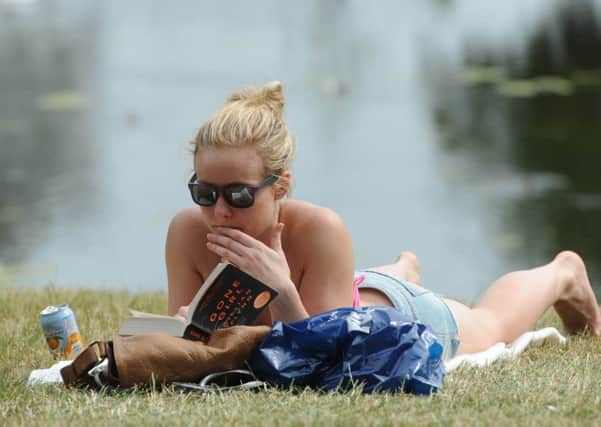 Sunbathing and reading a good book seem to go hand-in-hand  but not for Jim Duffy (Picture: Ian Rutherford)