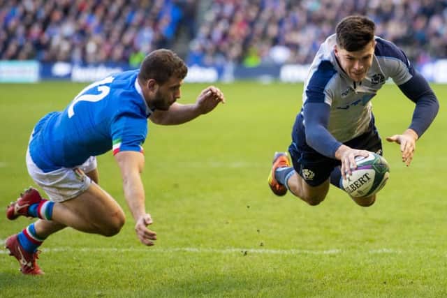 Kinghorn evades Tommaso Castello as he scores the second try. Picture: SNS Group