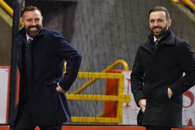 Kris Boyd, left, at Pittodrie with Scotland assistant boss James McFadden. Picture: SNS Group