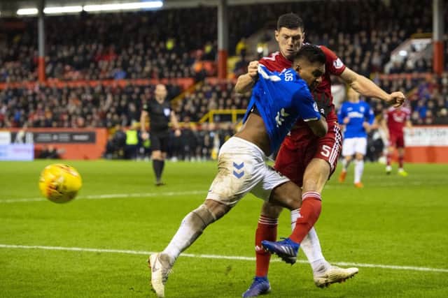 Alfredo Morelos and Scott McKenna tussle in an incident that saw the pair sent off. Picture: SNS Group
