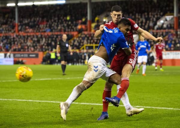Alfredo Morelos and Scott McKenna tussle in an incident that saw the pair sent off. Picture: SNS Group