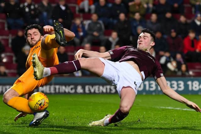 John Souttar battles for the ball with Livingston's Rickie Lamie. Pciture: SNS Group