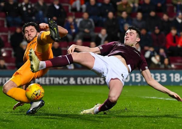 John Souttar battles for the ball with Livingston's Rickie Lamie. Pciture: SNS Group