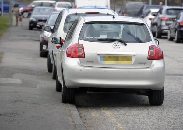 Air pollution is a serious problem but the workplace parking levy might make it worse for some in residential streets near offices (Picture: Neil Hanna)