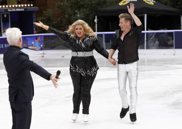Gemma Collins and her partner Matt Evers skate towards presenter Phillip Schofield ahead of the new series of Dancing on Ice (Picture: John Phillips/Getty Images)