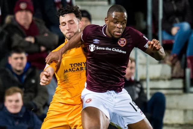 Uche Ikpeazu, in action against Livingston on Wednesday, battled back from a broken bone in his foot. Picture: SNS.