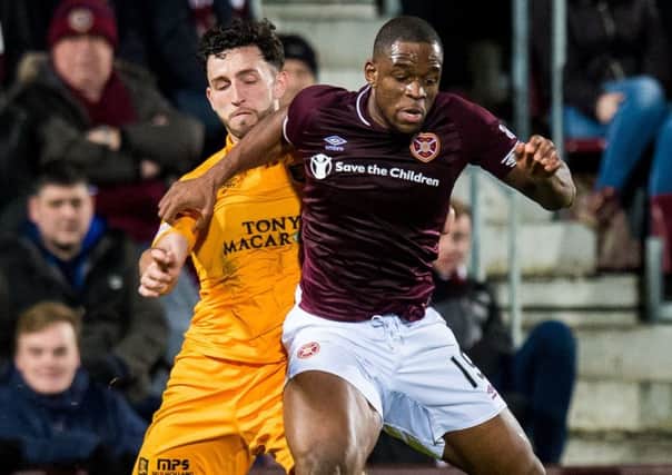 Uche Ikpeazu, in action against Livingston on Wednesday, battled back from a broken bone in his foot. Picture: SNS.