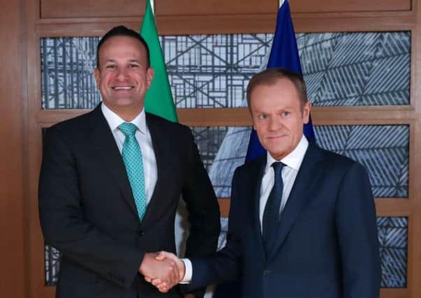Irish Prime Minister Leo Varadkar (L) shakes hands with European Council President Donald Tusk. Pic: Francisco Seco/AFP/Getty Images