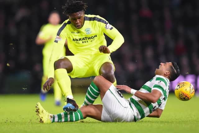 Johnson clashes with Emilio Izaguirre in the Ladbrokes Premiership clash at Parkhead. Picture: SNS Group