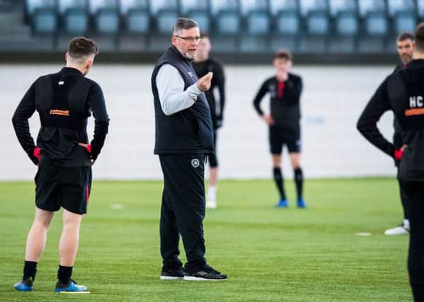 Craig Levein gives instructions to his players at a training session. Picture: SNS.
