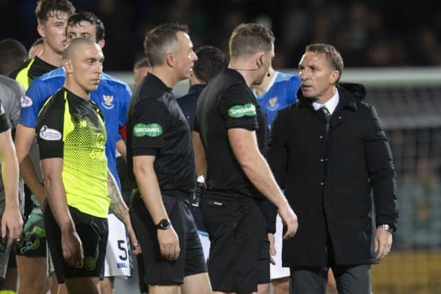 Celtic manager Brendan Rodgers talks to referee John Beaton. Picture: SNS