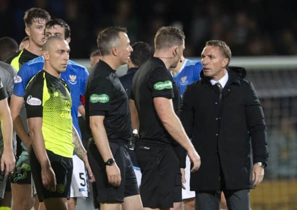 Celtic manager Brendan Rodgers talks to referee John Beaton. Picture: SNS