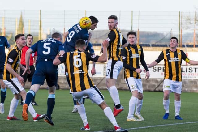 Partick Thistle's Steven Anderson opens the scoring with a header. Pic: SNS/Bruce White