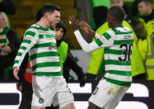 Celtic's Oliver Burke celebrates scoring against Hibs with Timothy Weah. Picture: SNS