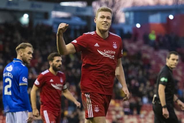 Sam Cosgrove celebrates the first of his two goals against Queen of the South. Picture: SNS Group