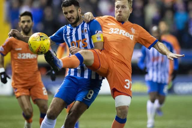 Scott Arfield, right, battles with Kilmarnock midfielder Gary Dicker. Picture: SNS