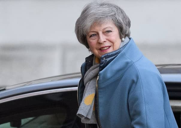 Theresa May runs through fields of wheat and also scrapes mould off jam (Picture: Leon Neal/Getty Images)