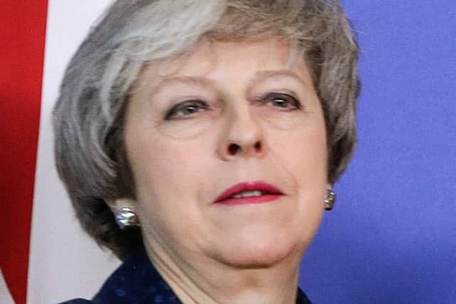 Theresa May's 'leverage' in the Brexit talks with Brussels is based on the idea the UK is prepared to ruin its own economy (Picture: Aris Oikonomou/AFPGetty Images)
