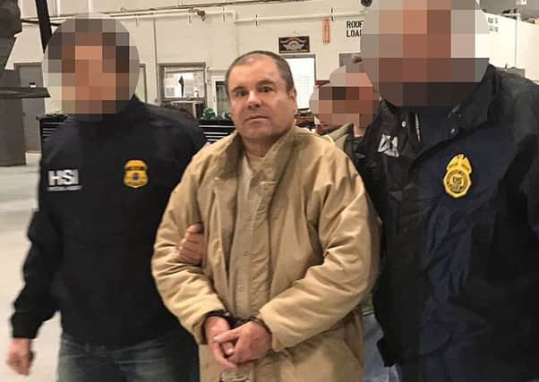 Joaquin Guzman Loera aka "El Chapo" Guzman (C) escorted in Ciudad Juarez by the Mexican police as he is extradited to the United States. Picture: Getty