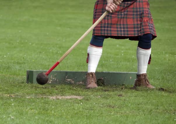 A competitor throwing the hammer at a Highland Games event in Scotland. Picture: Getty