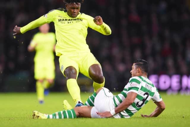 Darnell Johnson fouls Celtic's Emilio Izaguirre during the recent clash at Parkhead. Picture: SNS