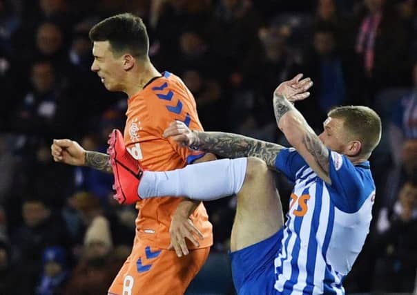 Alan Power tackles Rangers' Ryan Jack which earns the Killie man a yellow card. Picture: SNS
