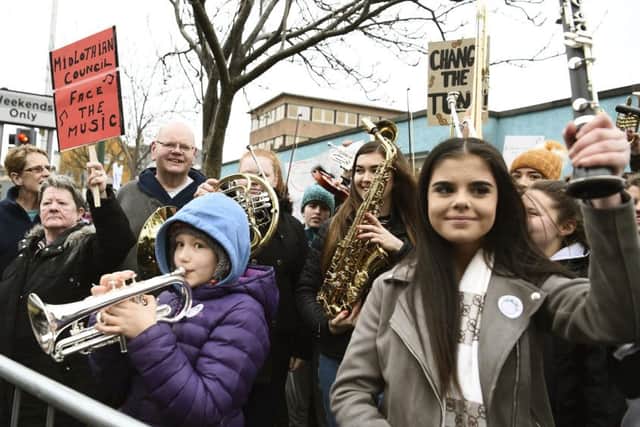 Protesters gather outside the council chambers in Dalkeith yesterday to fight for music tuition in schools. Picture: Lisa Ferguson