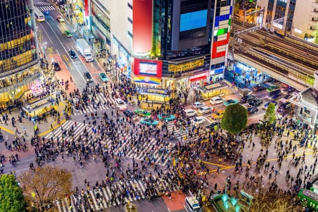 Down at street level in Shibuya, Tokyo pulses with life
