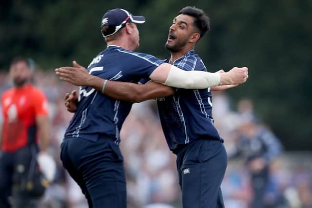 aafyan Sharif, right, celebrates victory over England with Scotland team-mate Alasdair Evans last year. Picture: PA.