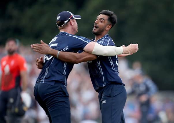 aafyan Sharif, right, celebrates victory over England with Scotland team-mate Alasdair Evans last year. Picture: PA.