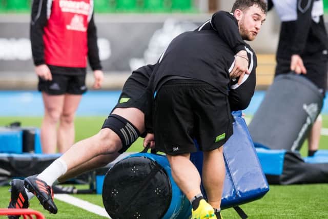 Adam Ashe throws himself into training with Glasgow Warriors as the back-row forward prepares for a trip to face Cardiff Blues. Picture: SNS/SRU