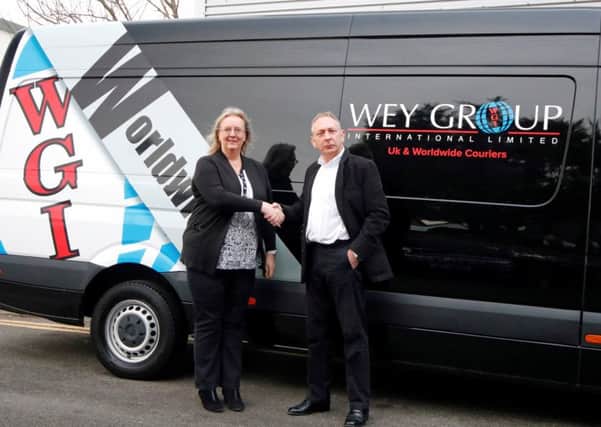 Fiona Deas, Eagle Couriers co-director, with Chris Jacobs, director of Wey Group International. Picture: Contributed