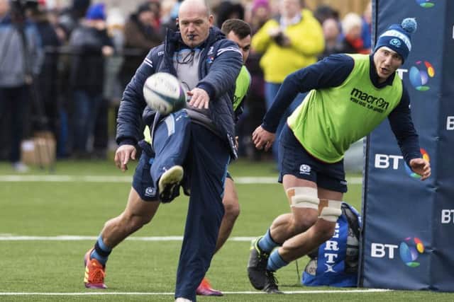 Scotland coach Gregor Townsend kicks ahead for flanker Jamie Ritchie to chase at a training session in Clydebank