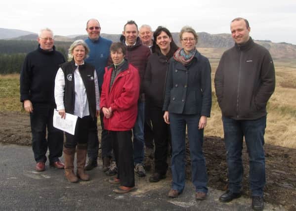 Biosphere trustees and visitors overlooking Cairnsmore National Nature Reserve.