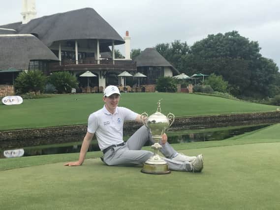 Baraassie's Euan Walker poses with the trophy after his African Amateur victory at Leopard Creek. Picture: Scottish Golf