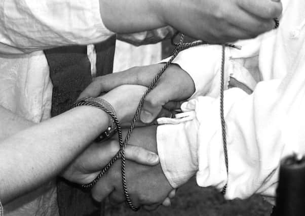 The old custom of handfasting is having a modern revival - although the meaning of the ritual has changed over time. PIC: Creative Commons/Flickr/Kam Abbott