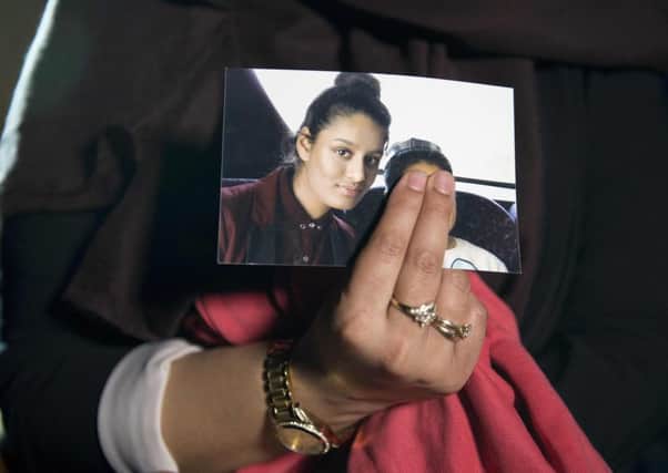 Renu Begum holds a picture of her younger sister, Shamima. Picture: Getty