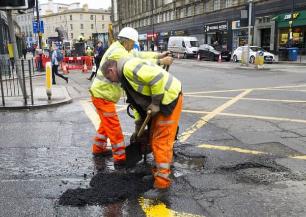 Pothole being repaired, Lothian Road Edinburgh.