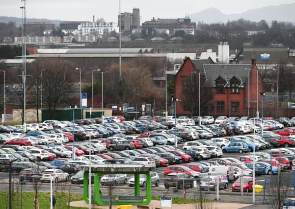 Car parking could become a lucrative revenue stream for Scottish towns and cities, such as Glasgow, under the budget proposals. Picture: John Devlin