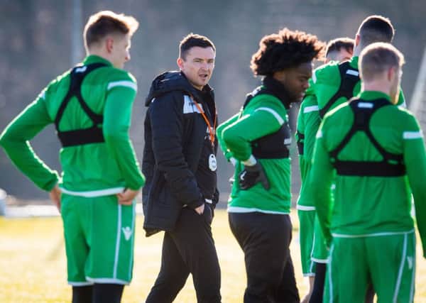 New 
Hibs head coach Paul Heckingbottom observes the players at training. Picture: Ross Parker/SNS