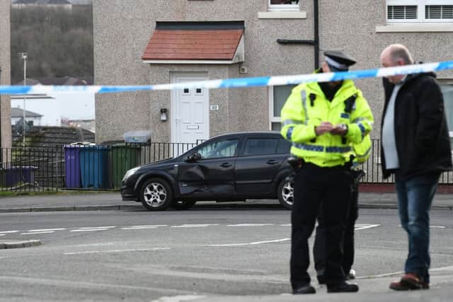 Cops raced to the scene on Dykemuir Street in the city's Springburn area after the alarm was raised around 11.15am this morning. Picture: John Devlin